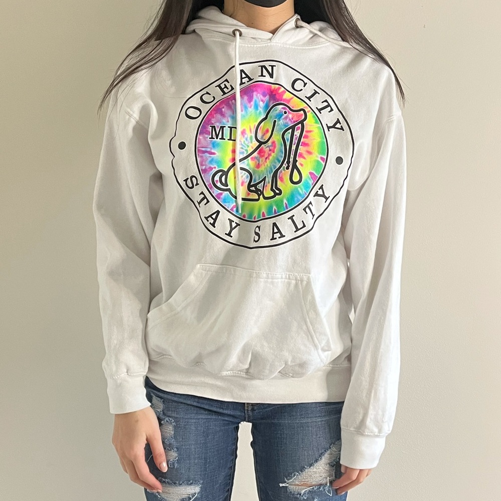 White hoodie with a tied dye print on it